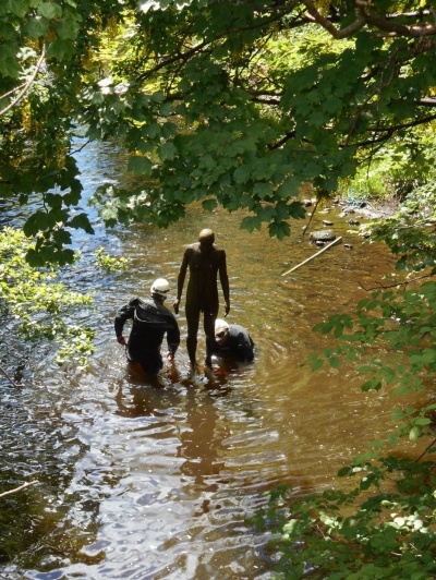 Luckily the river was low making it an easy job for the two men in wet suits